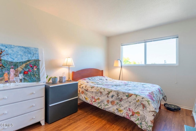 bedroom with wood-type flooring