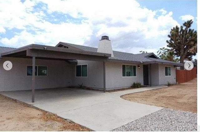 back of house featuring a patio area