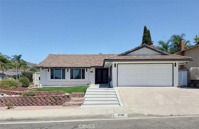 single story home featuring a garage