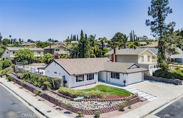 view of front of house with a front yard and a garage