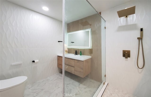 bathroom featuring tile walls, a shower, vanity, and toilet