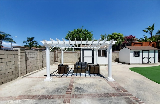 view of patio / terrace with a pergola and a shed