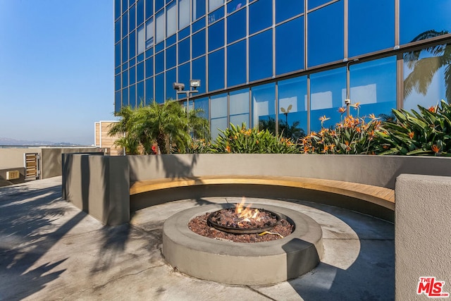 view of patio / terrace featuring a fire pit