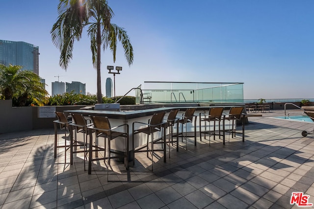 view of patio with a bar