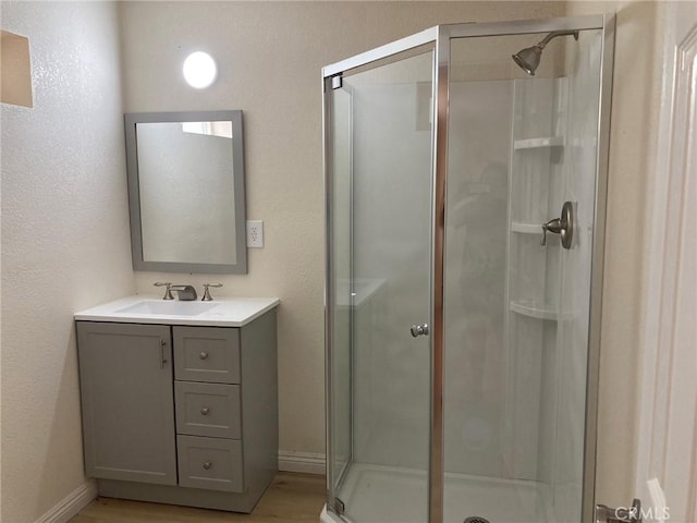 bathroom with vanity and an enclosed shower