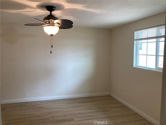 spare room with ceiling fan and light hardwood / wood-style floors