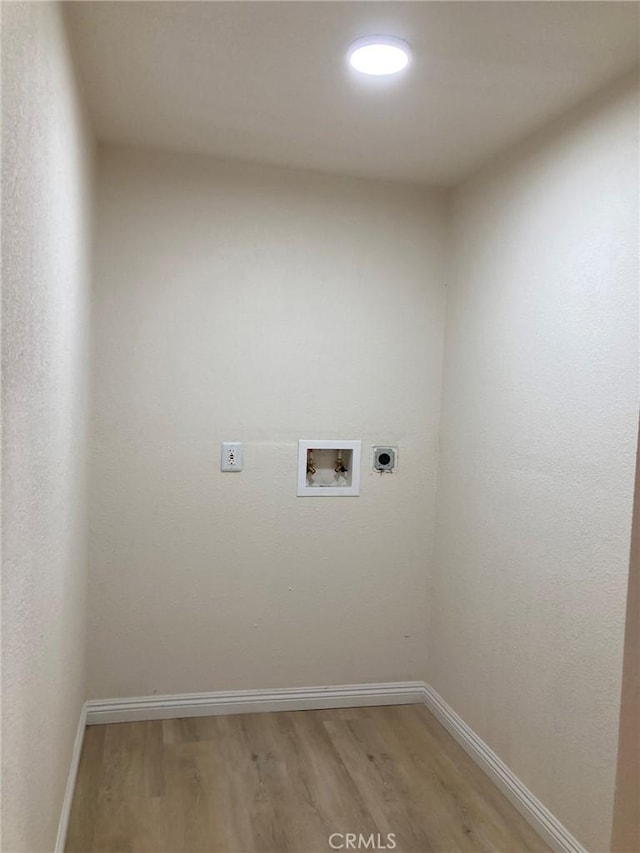 washroom featuring hardwood / wood-style floors, washer hookup, and hookup for an electric dryer