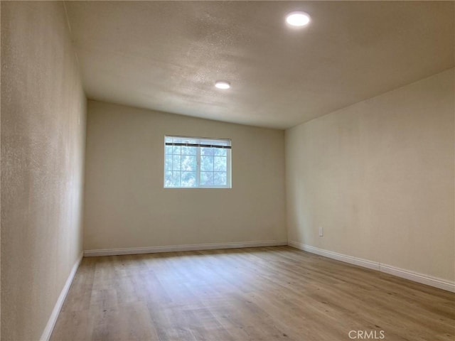 empty room with light wood-type flooring