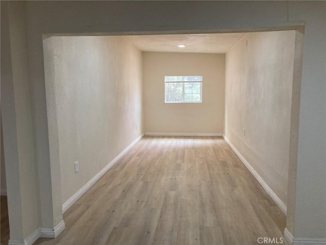 corridor featuring light hardwood / wood-style floors