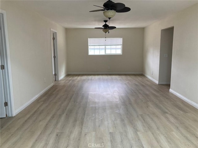 unfurnished room featuring ceiling fan and light hardwood / wood-style flooring