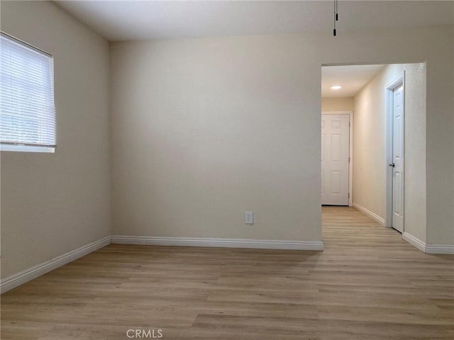 spare room with light wood-type flooring