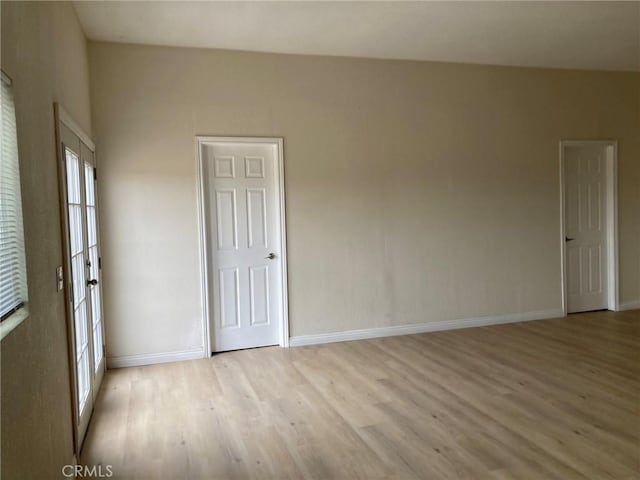 unfurnished room featuring light hardwood / wood-style flooring