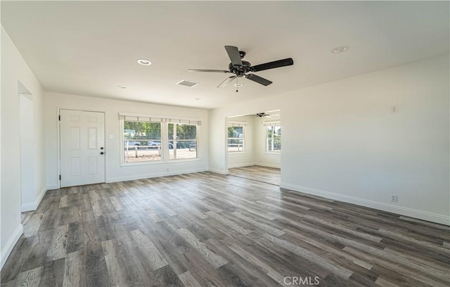 unfurnished room featuring ceiling fan and dark hardwood / wood-style floors