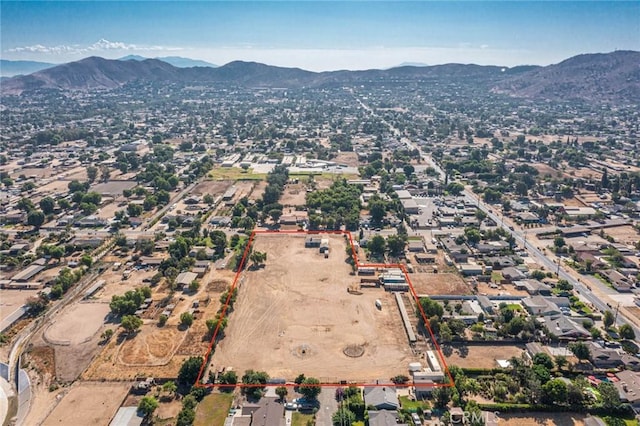 birds eye view of property featuring a mountain view