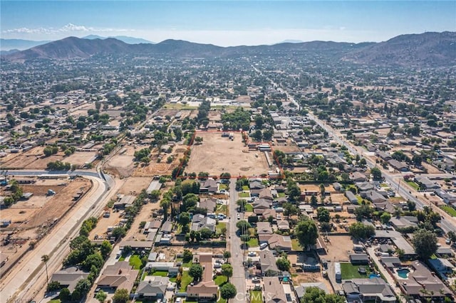 birds eye view of property featuring a mountain view