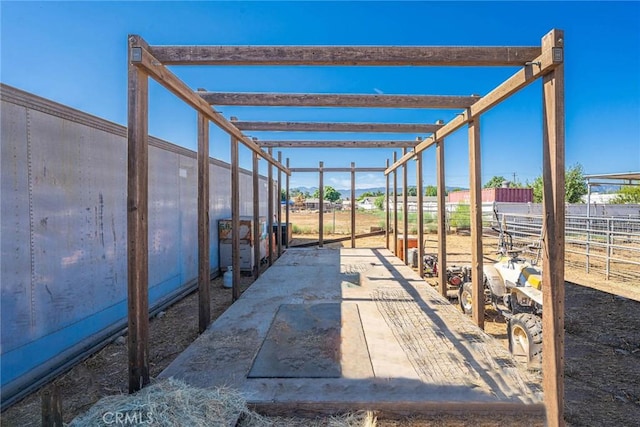 view of patio featuring an outbuilding