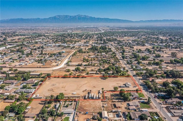 birds eye view of property featuring a mountain view