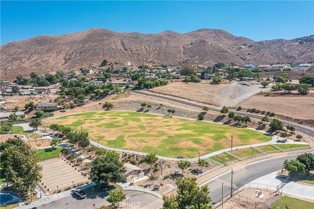 birds eye view of property with a mountain view