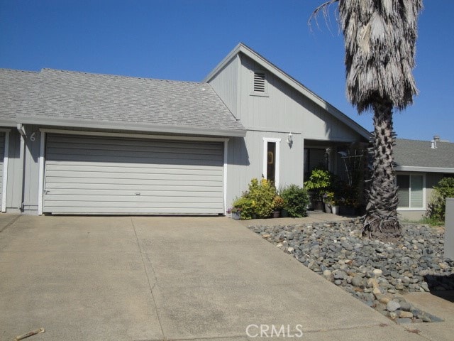 single story home featuring a garage