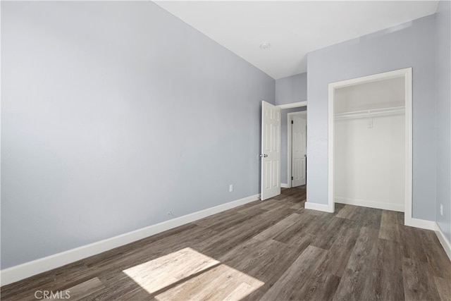 unfurnished bedroom with a closet and wood-type flooring