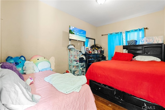 bedroom with wood-type flooring