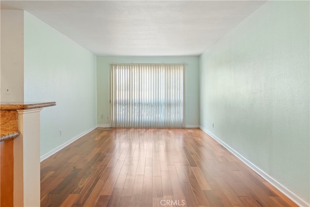 unfurnished living room featuring hardwood / wood-style floors