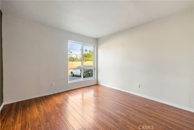 unfurnished room featuring hardwood / wood-style floors