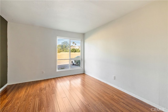 spare room featuring hardwood / wood-style floors