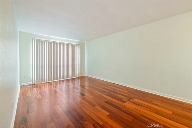 spare room featuring hardwood / wood-style floors