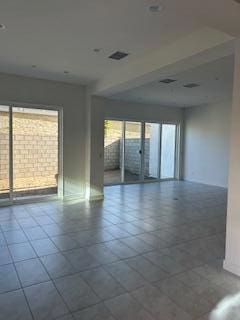 empty room featuring tile patterned flooring