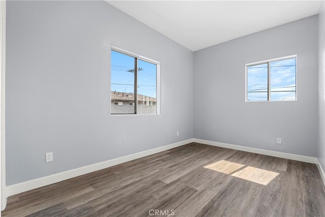 10406 Avalon Blvd, Los Angeles, CA 90003 - empty room with a healthy amount of sunlight and hardwood / wood-style flooring