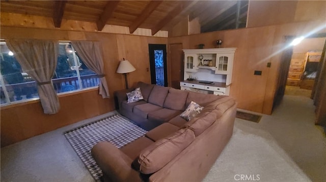 living room featuring lofted ceiling with beams and carpet