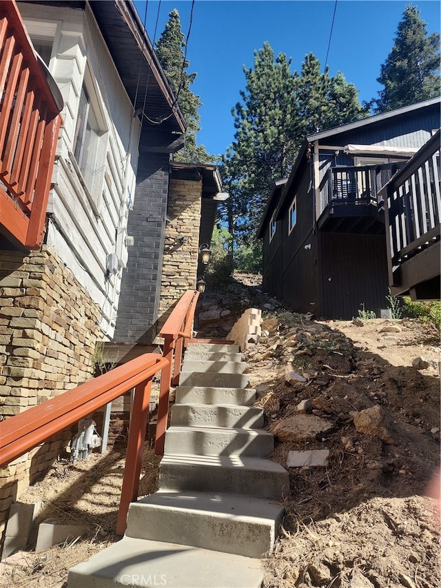 view of property exterior featuring a deck