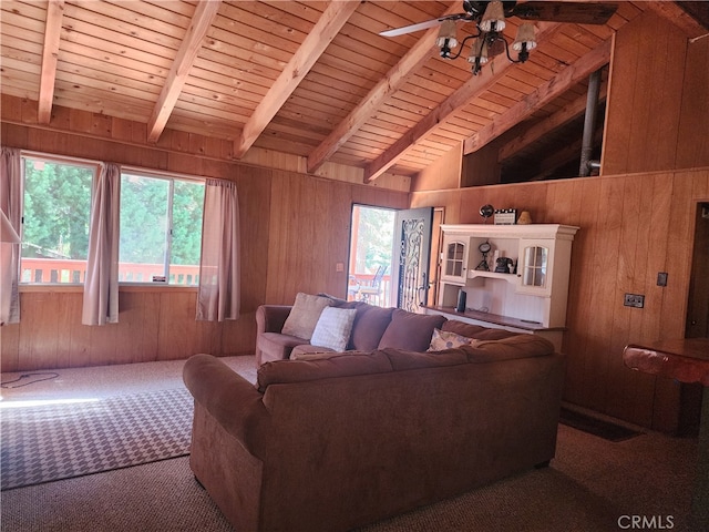 living room featuring wood walls, a wealth of natural light, vaulted ceiling with beams, and wood ceiling