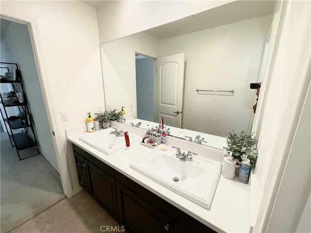 bathroom with tile patterned floors and vanity