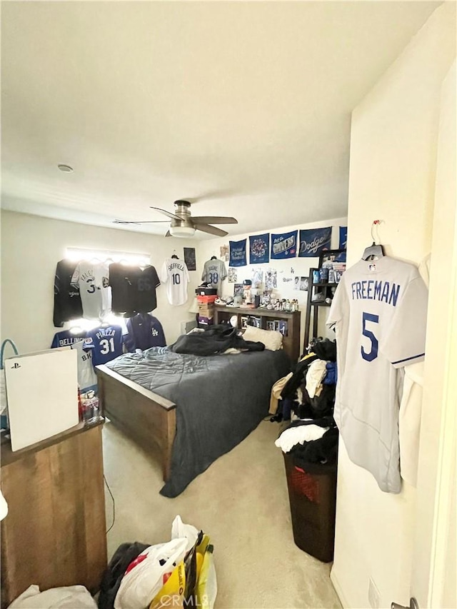 carpeted bedroom featuring ceiling fan