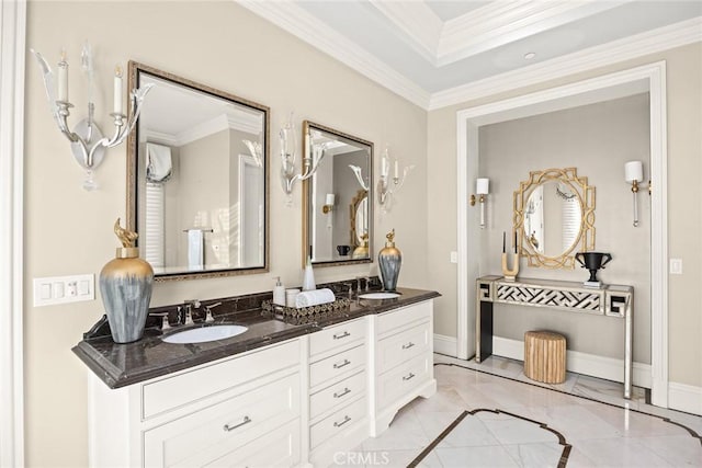 bathroom with crown molding and vanity