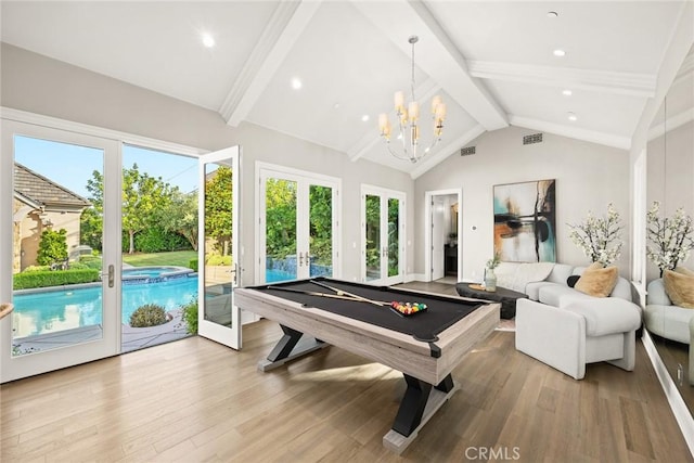 playroom featuring pool table, french doors, a healthy amount of sunlight, and light hardwood / wood-style flooring