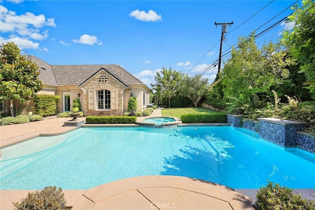 view of pool featuring an in ground hot tub