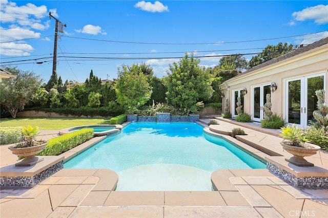 view of swimming pool featuring an in ground hot tub, french doors, and a patio