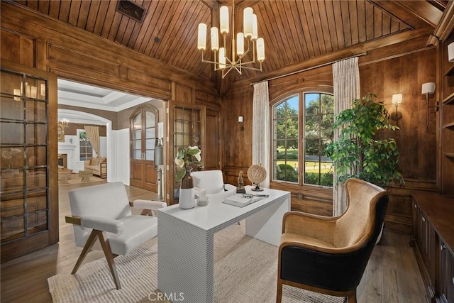 sunroom / solarium featuring wood ceiling and a notable chandelier