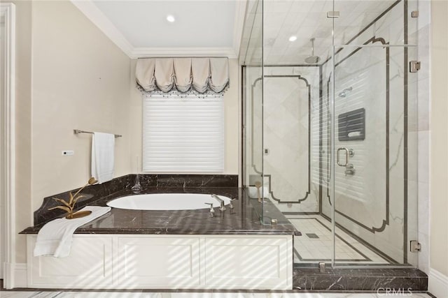 bathroom with independent shower and bath and crown molding