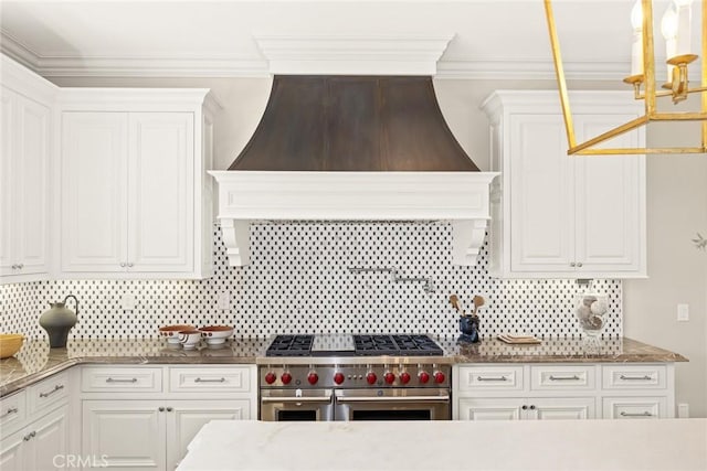 kitchen featuring tasteful backsplash, white cabinets, custom range hood, and ornamental molding