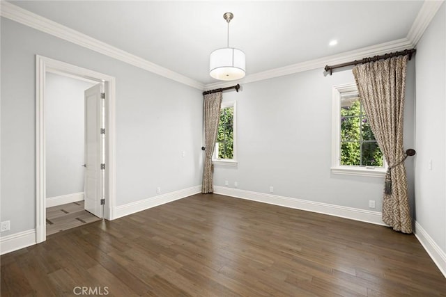 unfurnished room with dark hardwood / wood-style floors, a wealth of natural light, and ornamental molding