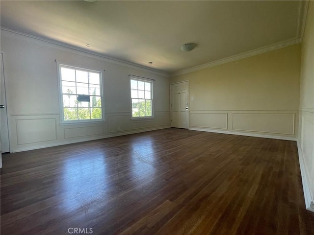 unfurnished room featuring crown molding and dark wood-type flooring