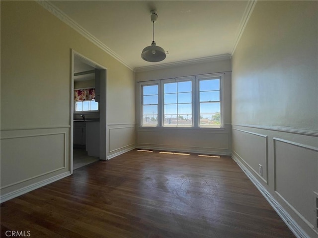 unfurnished dining area featuring dark wood-type flooring and ornamental molding