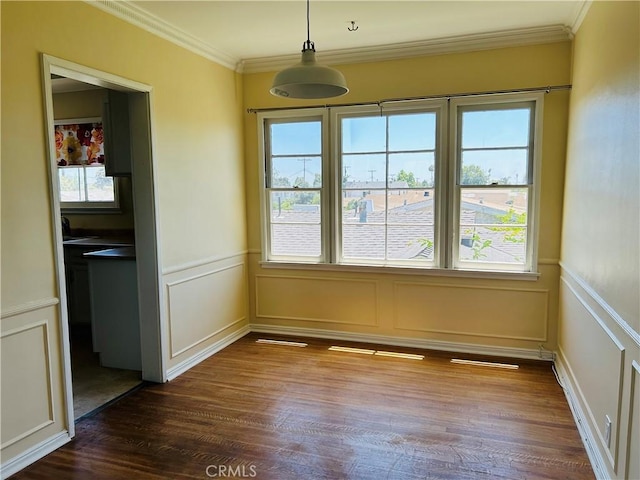 unfurnished dining area with crown molding and dark hardwood / wood-style floors