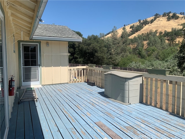 wooden terrace with a mountain view