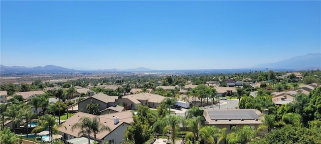 drone / aerial view featuring a residential view and a mountain view