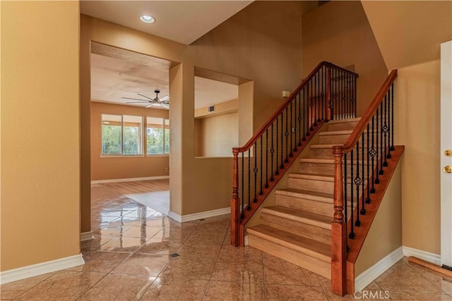 staircase with recessed lighting, visible vents, a ceiling fan, baseboards, and marble finish floor